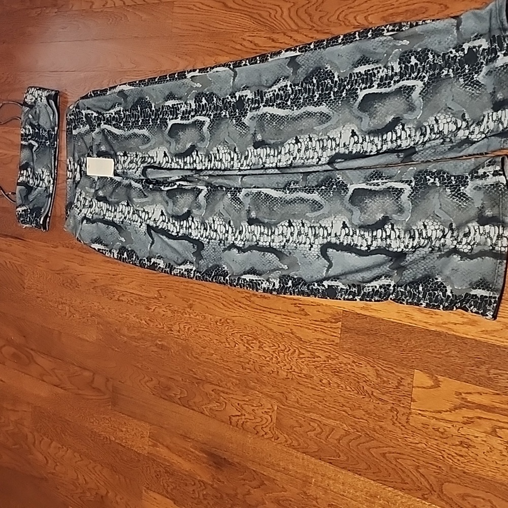 Beautiful 2 piece Flare pants crap off the shoulder top looks like snake skin.